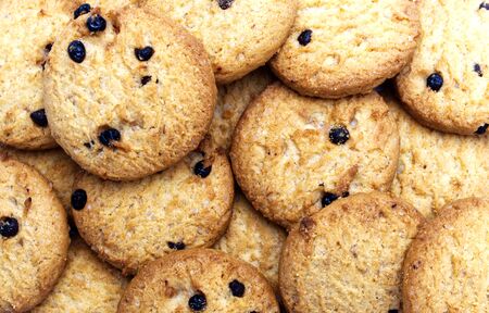 Closeup a group of Chocolate chip cookies fill the frame. Sweet biscuits delicious and crunchy homemade pastry.の写真素材