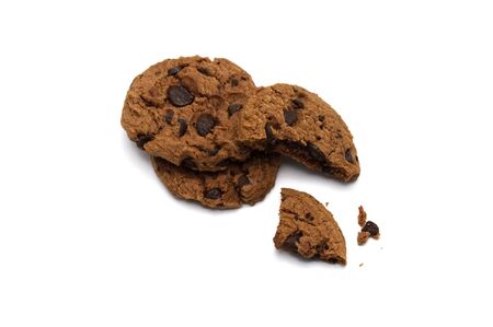 Chocolate chip cookies with some broken and crumbs on white background.の写真素材