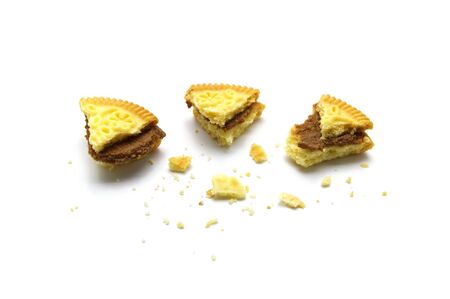 Sandwich cookies filled with coffee cream flavored. Some broken and crumbs of crunchy delicious...