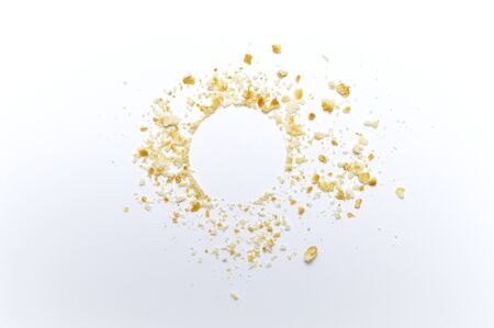 Scattered crumbs of cookies on white background. Copy space.の写真素材