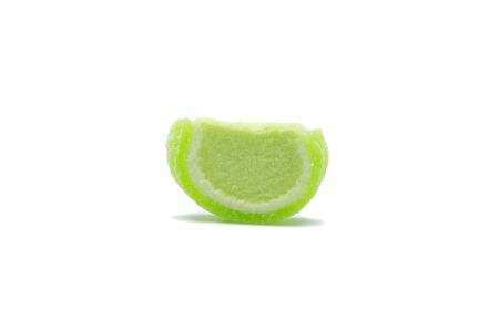 A piece of Gelatin jelly green color candy Watermelon design isolated on white background. の写真素材