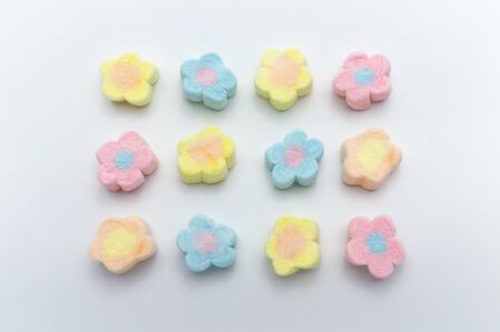Pastel sweet flowers shape of marshmallows on white background.の写真素材