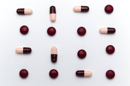 Different colorful medicine pills and 
capsules or supplements for the treatment and health care on a white background.の写真素材