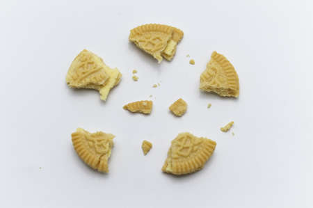 LAMPHUN, THAILAND - JUNE 5, 2019: Jack and Jill Biscuits with crumbs on white background. It is a sandwich cookies filled with custard flavored cream.のeditorial素材