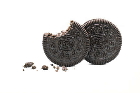 Oreo Biscuits isolated on white background. Sandwich chocolate cookies with a sweet cream is the...