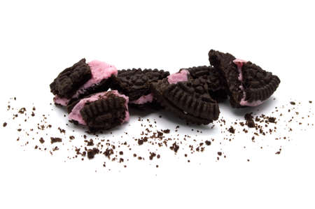 LAMPHUN, THAILAND - JULY 31, 2019: Oreo Biscuits with crumbs on white background. It is a chocolate sandwich cookies with strawberry flavored cream is the best selling dessert in Thailand.のeditorial素材