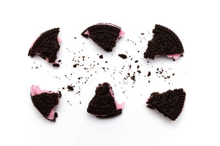 LAMPHUN, THAILAND - JULY 31, 2019: Oreo Biscuits with crumbs on white background. It is a chocolate sandwich cookies with strawberry flavored cream is the best selling dessert in Thailand.のeditorial素材