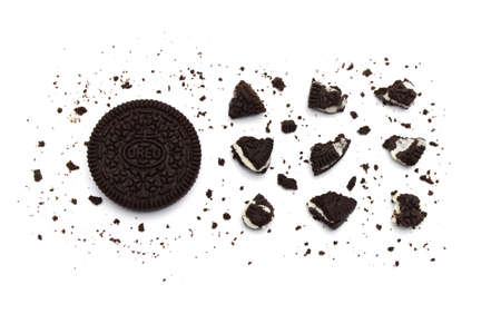 LAMPHUN, THAILAND - JULY 4, 2019: Oreo Biscuits with crumbs on white background. It is a sandwich cookies filled with chocolate cream flavored. The best selling dessert in Thailand.のeditorial素材