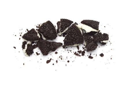 LAMPHUN, THAILAND - JUNE 18, 2019: Oreo Biscuits with crumbs on white background. It is a sandwich chocolate cookies with a sweet cream is the best selling dessert in Thailand.のeditorial素材