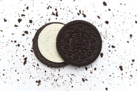 LAMPHUN, THAILAND - JUNE 18, 2019: Oreo Biscuits with crumbs on white background. It is a sandwich chocolate cookies with a sweet cream is the best selling dessert in Thailand.のeditorial素材