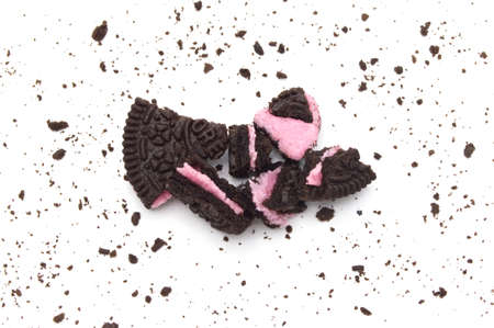 LAMPHUN, THAILAND - JULY 2, 2019: Oreo Biscuits with crumbs on white background. It is a chocolate...