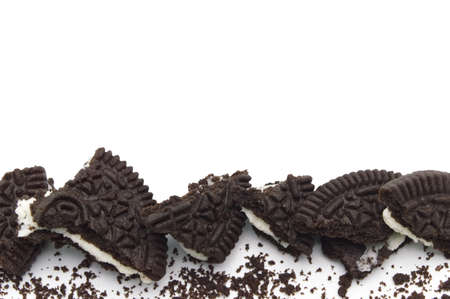 LAMPHUN, THAILAND - JUNE 27, 2019: Oreo Biscuits with crumbs isolated on white background. It is a...