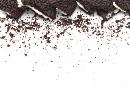 LAMPHUN, THAILAND - JUNE 27, 2019: Oreo Biscuits with crumbs on white background. It is a sandwich cookies filled with chocolate cream flavored. The best selling dessert in Thailand.のeditorial素材