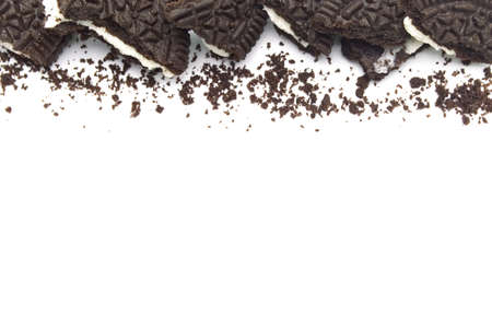 LAMPHUN, THAILAND - JUNE 27, 2019: Oreo Biscuits with crumbs on white background. It is a sandwich cookies filled with chocolate cream flavored. The best selling dessert in Thailand.のeditorial素材