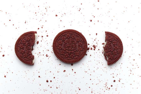 LAMPHUN, THAILAND - AUGUST 27, 2019: Oreo Biscuits broken and crumbs on white background. It is a...