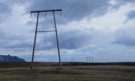 Power lines stretching across beautiful country side in Icelandの写真素材