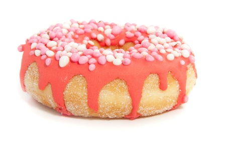 a pink glazed donut with colorful speckles on topの写真素材