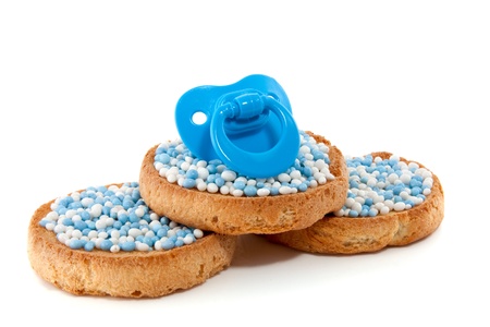 baby pacifier on top of Dutch Birth biscuitsの写真素材