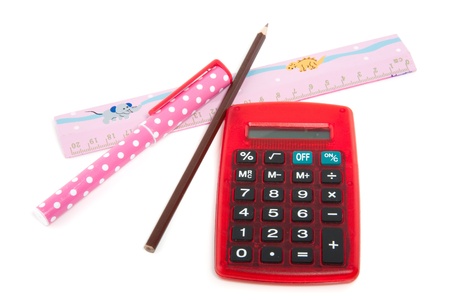 a red calculator and office supplies isolated over whiteの写真素材