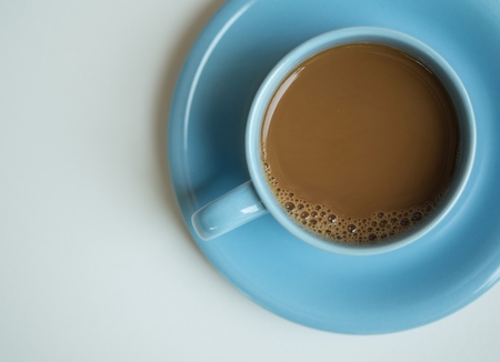 Cup of coffee on white tableの写真素材