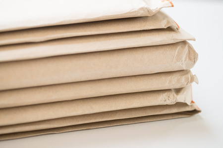 Brown envelope on white backgroundの写真素材