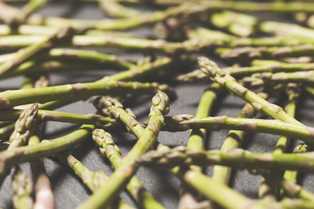 Fresh asparagus on a rustic slate backgroundの写真素材