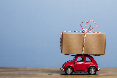 Festive christmas car with a presentの写真素材