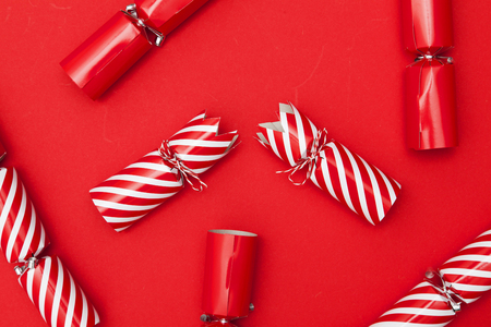 Christmas crackers on a red backgroundの写真素材