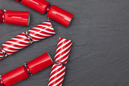 Christmas crackers on a slate background crackersの写真素材