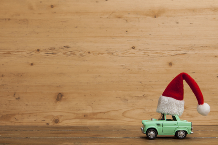 LONDON, UK - DECEMBER 30th 2016: Christmas background concept. Toy car with a Santa hatのeditorial素材