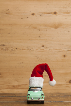 LONDON, UK - DECEMBER 30th 2016: Christmas background concept. Toy car with a Santa hatのeditorial素材