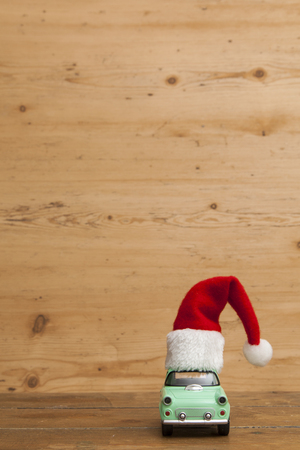LONDON, UK - DECEMBER 30th 2016: Christmas background concept. Toy car with a Santa hatのeditorial素材