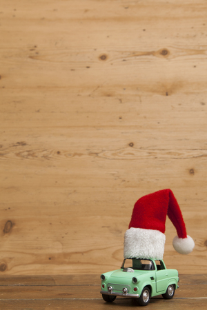 LONDON, UK - DECEMBER 30th 2016: Christmas background concept. Toy car with a Santa hatのeditorial素材