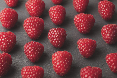 Fresh red raspberries background