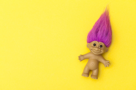LONDON, UK - DECEMBER 4th 2017: An original troll plastic toy figure with bright coloured hair. First produced in Denmark by Thomas Damのeditorial素材
