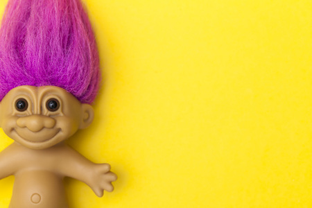 LONDON, UK - DECEMBER 4th 2017: An original troll plastic toy figure with bright coloured hair. First produced in Denmark by Thomas Damのeditorial素材