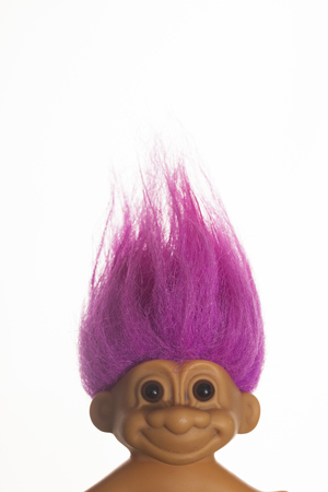 LONDON, UK - DECEMBER 4th 2017: An original troll plastic toy figure with bright coloured hair. First produced in Denmark by Thomas Damのeditorial素材