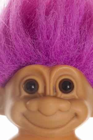 LONDON, UK - DECEMBER 4th 2017: An original troll plastic toy figure with bright coloured hair. First produced in Denmark by Thomas Damのeditorial素材