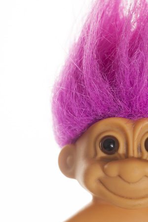 LONDON, UK - DECEMBER 4th 2017: An original troll plastic toy figure with bright coloured hair. First produced in Denmark by Thomas Damのeditorial素材