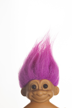 LONDON, UK - DECEMBER 4th 2017: An original troll plastic toy figure with bright coloured hair. First produced in Denmark by Thomas Damのeditorial素材