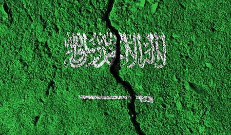 Saudi Arabia flag with crack through the middle. Country divided conceptの写真素材