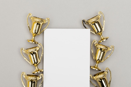 Gold winners trophy with blank certificateの写真素材