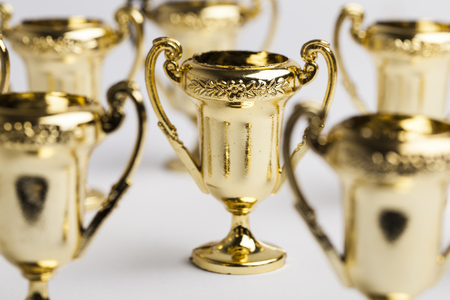Gold winners achievement trophy backgroundの写真素材