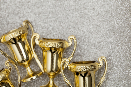 Gold winners achievement trophy backgroundの写真素材