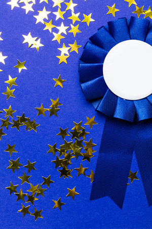 First place award rosette with gold stars. Success achievement conceptの写真素材