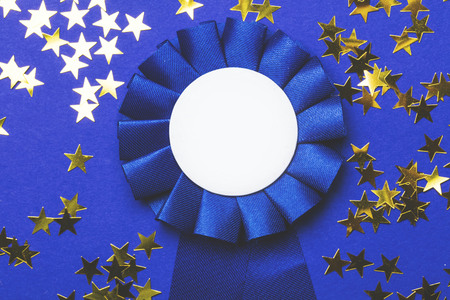First place award rosette with gold stars. Success achievement conceptの写真素材