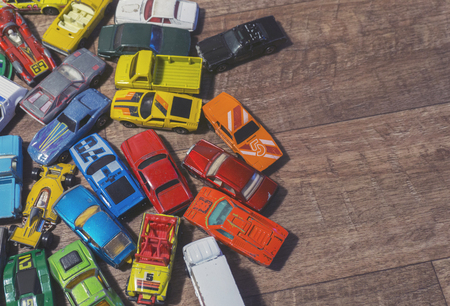 vintage toy cars on a wooden backgroundの写真素材