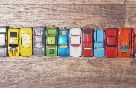 vintage toy cars on a wooden backgroundの写真素材