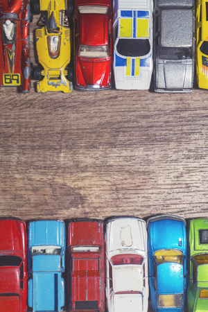 vintage toy cars on a wooden backgroundの写真素材