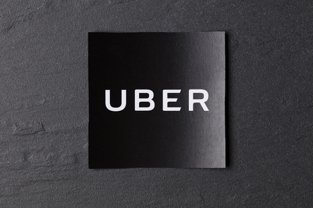 A photograph of  the Uber logo. Uber is a popular taxi style transport service application, founded in 2009のeditorial素材